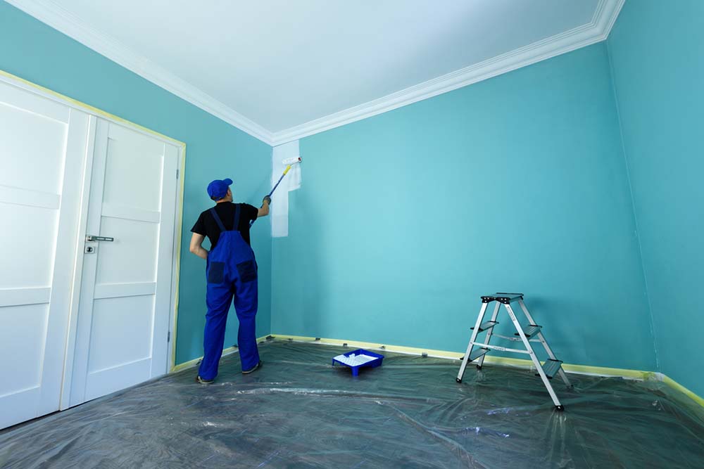 Professional painter applying premium interior paint - Schenectady, NY - VividPro Painters